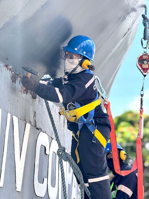 Maritime officer at the helm during a sea passage
